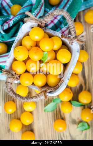 Yellow fresh cherry plum on the table Stock Photo