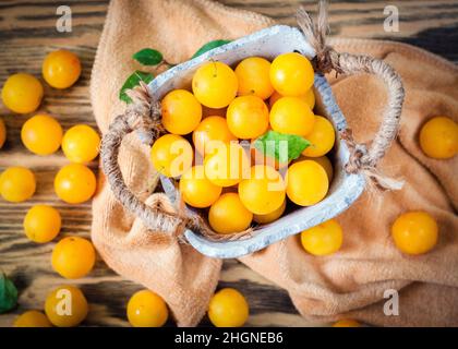 Yellow fresh cherry plum on the table Stock Photo