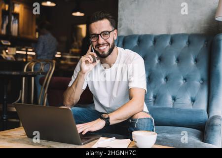 happy Caucaisan blogger using 4g for calling and talk Stock Photo