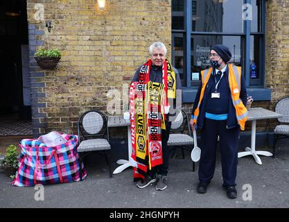 London, UK. 22nd January 2022. A scarf seller during the Premier League match at Brentford Community Stadium, London. Picture credit should read: David Klein / Sportimage Credit: Sportimage/Alamy Live News Stock Photo