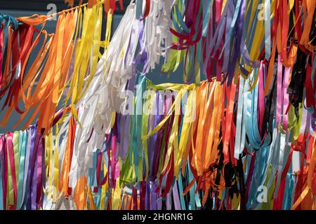 Multicolored ribbons festive decoration abstract background. Stock Photo
