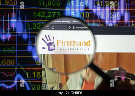 Firsthand Technology company logo on a website with blurry stock market developments in the background, seen on a computer screen Stock Photo