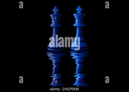 European Union and North Atlantic Treaty Organization (nato) flags paint over on chess king. 3D illustration. Stock Photo