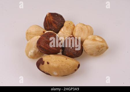 Closeup on natural healthy protein nourishment , an aggregation of various nuts on white background Stock Photo