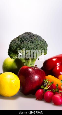 vegan food: pinto beans, radishes, carrots, red apple and soy, broccoli Stock Photo