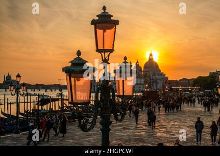 Sunset with the lamp standards on the Rive Shiavoni, The Grand Canal, Venice, Italy Stock Photo