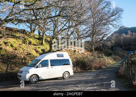 In,January,on,a,winter,winters,sunny,day,VW,Volkswagen,campervan,van,vanlife,staycation,parked,up,at,Dolbadarn Castle,grounds,a,scenic,scenery,rural,location,and,free,tourist,visitor,attraction,in,Llanberis,Llanberis village,is,a community and electoral ward in, Gwynedd, northwest Wales, on the southern bank of the lake Llyn Padarn and at the foot of Snowdon, the highest mountain in Wales.Rural,countryside,scenic,scenery,in,on,at,Snowdonia,Snowdonia National Park,Mid,North,West,Kingdom,North Wales,Wales,Welsh,GB,Great Britain,British,UK,United Stock Photo