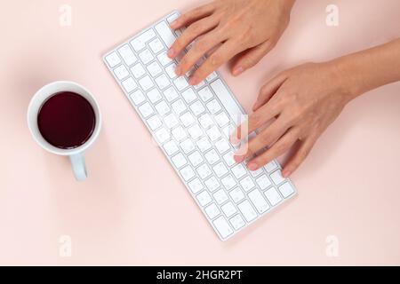 person typing on a laptop keyboard Stock Photo