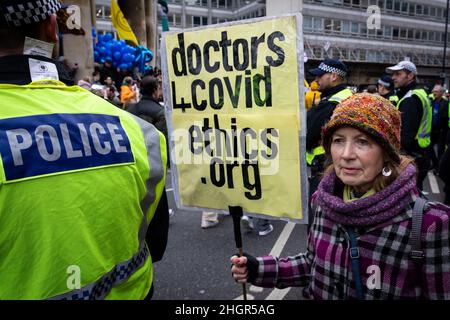 London, UK. 22nd Jan, 2022. A protester with a placard waits the start of the rally. As the mandate to get vaccinated against COVID-19 draws ever closer NHS workers join the protest. The anti-lockdown demonstration was organised by the World Wide Rally For Freedom movement. Credit: Andy Barton/Alamy Live News Stock Photo