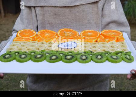 Indian Republic day themed food decorated and served to celebrate India republic day on 26 january. Person celebrating with healthy food Stock Photo