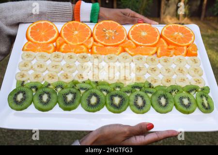 Indian Republic day themed food decorated and served to celebrate India republic day on 26 january. Person celebrating with healthy food Stock Photo