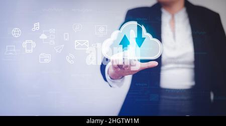 Businesswoman touching a cloud networking concept and touch screen with hand connection line on the black background, Cloud computing is system for sh Stock Photo
