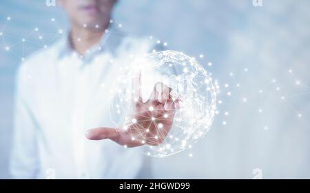 Businessman holding connections system and global data exchange. ,Business network connection concept. hologram screen displaying modern web system Wi Stock Photo