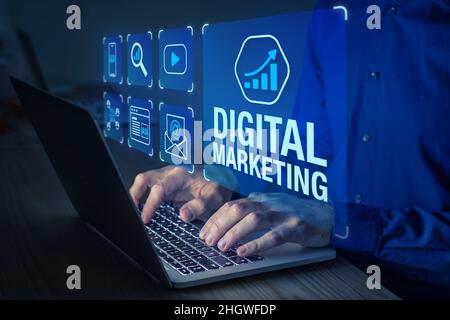 Digital marketing manager working on social media network advertising, online ad on internet website, mobile and email newsletter communication advert Stock Photo