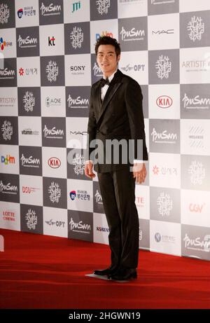 October 4, 2012 - Busan, South Korea : Actor Kim Kang Woo pose for photo call during the 17th Busan International Film Festival Opening red carpet event at the Busan Cinema Center. Along with the now inevitable galaxy of stars promoting blockbusters from across Asia, this year's Busan International Film Festival will screen a North Korean film for the first time in almost a decade as well as six classic Afghan movies that were hidden in a wall to save them from the Taliban. Stock Photo