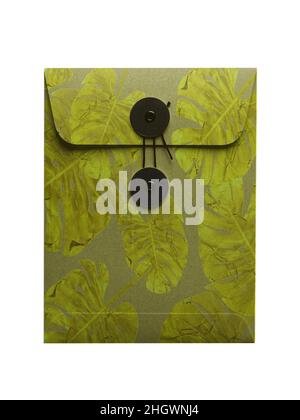 String envelope in vintage style isolated on white background. Green leaves pattern. Kraft paper. Stock Photo