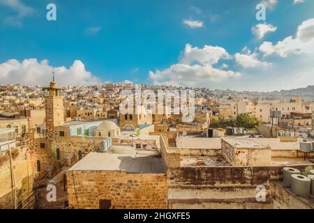 View to the Hebron old city of from a rooftop beside Qazazen mosque in Hebron, West Bank, Palestine Stock Photo