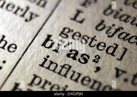 Definition of word bias on dictionary page, close-up Stock Photo