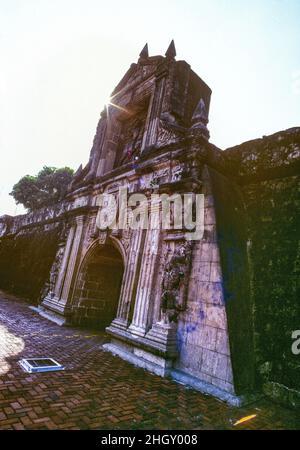 The main entry gate to Fort Santiago in Manila, the Philippines. The historic citadel was built in 1593 by the Spanish navigator and governor Miguel López de Legazpi for the newly established City of Manila. The fortress is located in Intramuros, the walled city of Manila. It is one of the most important historical sites in the Philippines. Several lives were lost in its prisons during the Spanish Empire and World War II. José Rizal, one of the Philippines' national heroes, was imprisoned here before his execution in 1896. Stock Photo
