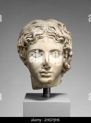 Marble head of a youth A.D. 117–161 Roman This idealized head is carved in a manner that brilliantly evokes the qualities of metal in the medium of stone. The polished flesh, sharply outlined eyes, and individualized locks of hair were all typical features of bronze sculpture that were imitated in marble as part of the classicizing taste that prevailed during the reign of the emperor Hadrian in the early 2nd century A.D.. Marble head of a youth. Roman. A.D. 117–161. Marble, Pentelic ?. Hadrianic or Early Antonine. Stone Sculpture Stock Photo