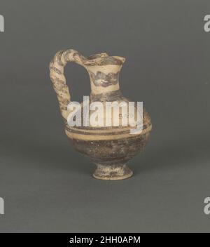 Ancient Greek Cypriot geometric pottery cup with a dark painted bird ...