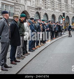 Veterans on Regent street in London prepare to salute NHS workers protesting against mask and vaccine mandates. Stock Photo