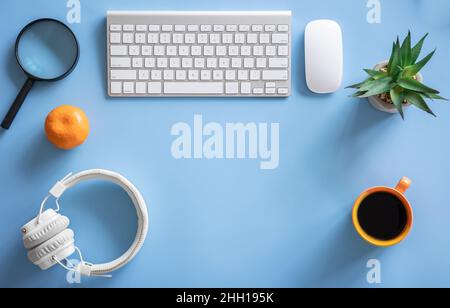 Flat lay, hobby, study and work concept on blue background. Stock Photo
