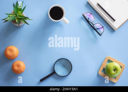 Flat lay, hobby, study and work concept on blue background. Stock Photo