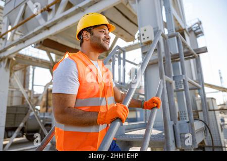 African male engineer inspecting site at construction plant Stock Photo