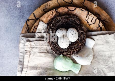 Easter dinner table settinf with colored eggs served on the table Stock Photo