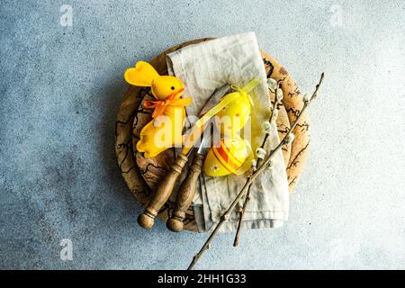 Easter dinner table settinf with colored eggs served on the table Stock Photo