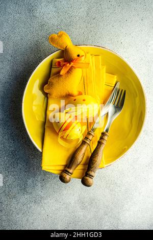 Easter dinner table settinf with colored eggs served on the table Stock Photo