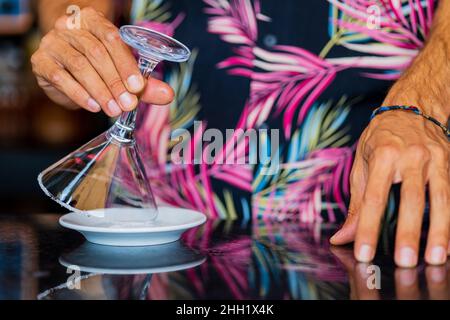close up shot of hands bartender preparing cocktail at the resort bar Stock Photo