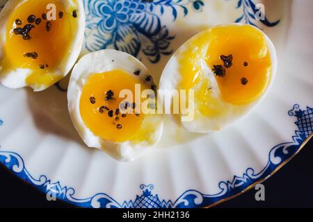 soft boiled eggs on blue and white plate Stock Photo