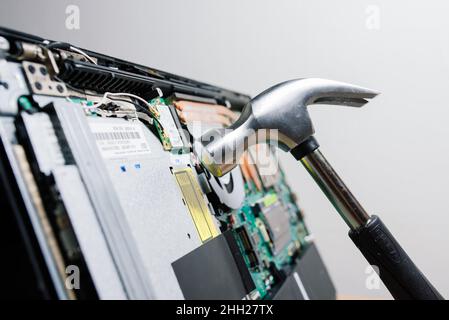 Service engineer install new chips to laptop. Repairing and upgrading laptop concept. Close up. Stock Photo