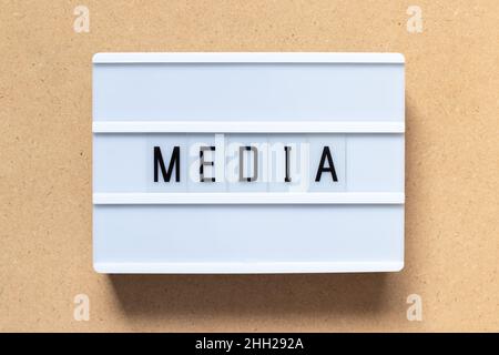 White lightbox with word media on wood background Stock Photo