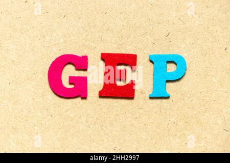 Color cloth alphabet letter in word GEP (abbreviation of good engineering practice) on wood background Stock Photo