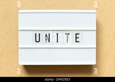 Lightbox with word unite on wood background Stock Photo