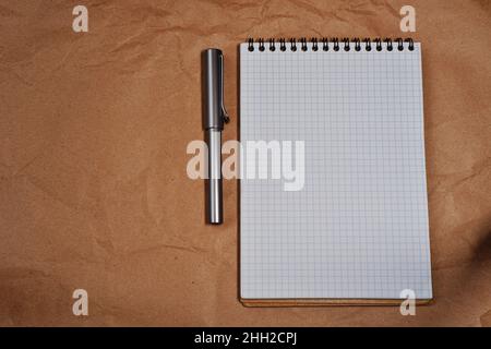 White Spiral notebook and Lamy fountain pen with copy space Stock Photo