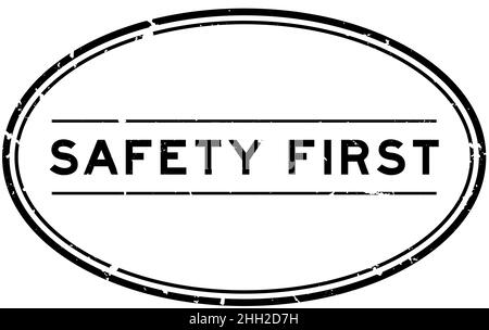 Grunge black safety first word oval rubber seal stamp on white background Stock Vector