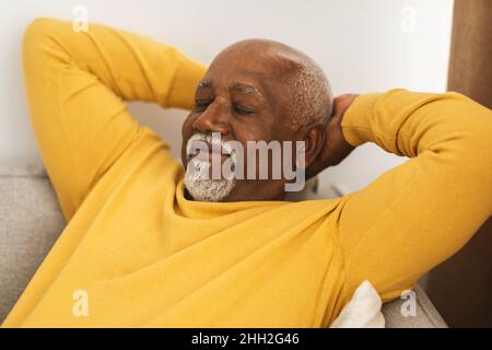 Mature African American Male Sleeping Relaxing On Couch At Home Stock Photo