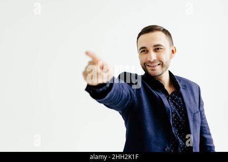 Businessman pressing an imaginary button on white Stock Photo