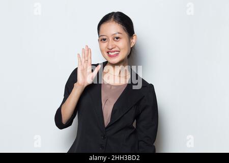 Asian business woman say hello isolated on white background Stock Photo