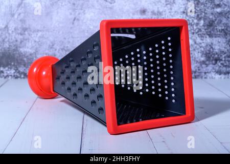 https://l450v.alamy.com/450v/2hh3fhy/grater-for-vegetables-on-a-background-of-light-marble-kitchen-grater-close-up-2hh3fhy.jpg