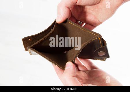 Hands holding an empty wallet. Bankruptcy - Business Person holding an empty wallet Stock Photo