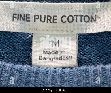 Blue jumper with label 'Made In Bangladesh' Stock Photo