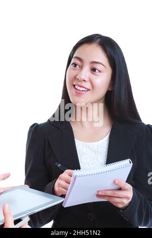 Businesswoman talking with someone holding using digital tablet. Asian woman tooth smile, she has a look of enjoyment on her face, on white background Stock Photo