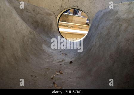 View into a sewage shaft from the perspective of the canal Stock Photo