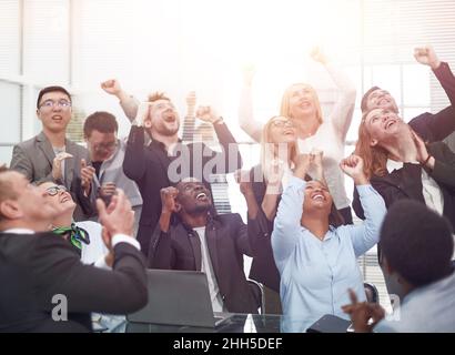 Large business team showing unity with their hands together Stock Photo