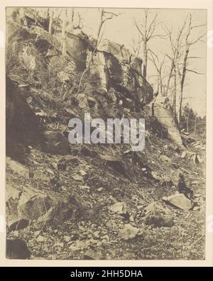 [Rocky Hillside] 1850s Victor Prevost French Born in France, Victor Prevost emigrated to America in 1848 and remains one of the country's most enigmatic early photographers using the paper negative process. Prevost had learned his technique directly from Gustave Le Gray, the leading French photographer of the day, and used it with great success to photograph the evolving shape of New York City beginning in 1853. His views of the ever-changing facades of businesses on Broadway, the city's most active commercial artery, show remarkable aesthetic and historical sensitivity. Prevost's unusual aest Stock Photo
